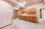 This newly remodeled kitchen boasts beautiful light wood cabinets and granite countertops, creating a bright and airy atmosphere.