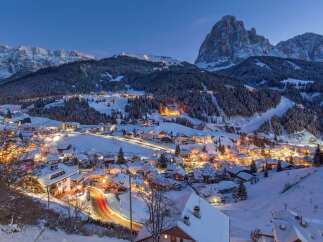 Nestled in a snow-covered valley, this charming village offers breathtaking views of the majestic mountains.