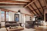 This stunning chalet boasts a spacious open-plan living area with exposed wooden beams and large windows offering breathtaking mountain views.