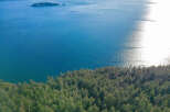 Spectacular waterfront property boasting breathtaking ocean views and lush evergreen forest.