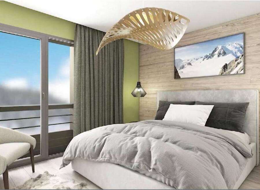 This stunning bedroom boasts a cozy and modern design, featuring a plush bed with soft linens and a large window offering breathtaking mountain views.