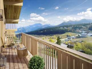 This stunning property boasts a spacious balcony with breathtaking mountain views, perfect for relaxing and enjoying the fresh air.