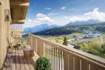 This stunning property boasts a spacious balcony with breathtaking mountain views, perfect for relaxing and enjoying the fresh air.