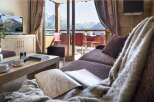 This luxurious apartment boasts breathtaking mountain views from its spacious living area.