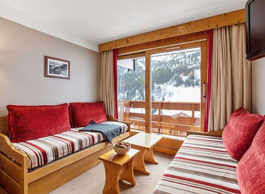 Cozy chalet apartment with stunning mountain views.