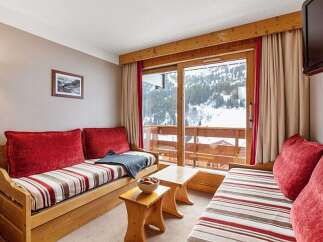 Cozy chalet apartment with stunning mountain views.