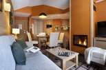 Cozy living room with a fireplace and comfortable seating.