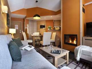 Cozy living room with a fireplace and comfortable seating.