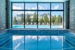 Indulge in a luxurious indoor pool experience with breathtaking mountain views.
