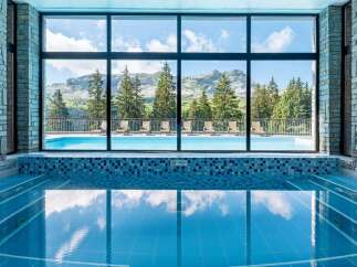 Indulge in a luxurious indoor pool experience with breathtaking mountain views.
