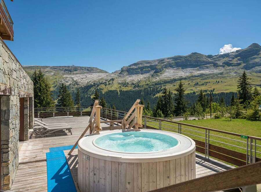 Luxury chalet with stunning mountain views and private hot tub.