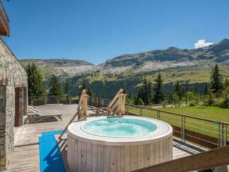 Luxury chalet with stunning mountain views and private hot tub.