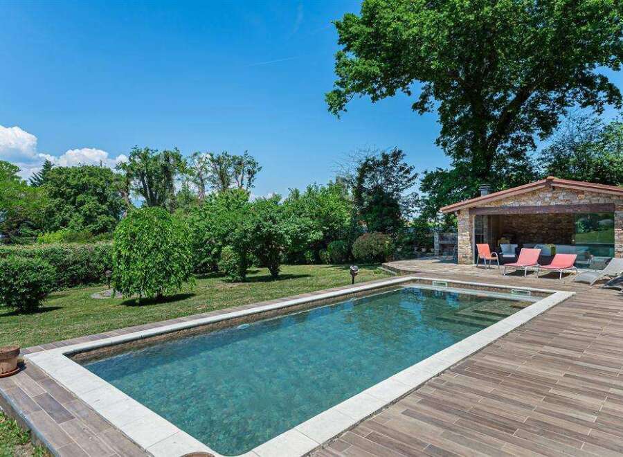 Luxury villa with private pool and outdoor entertainment area.