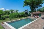 Luxury villa with private pool and outdoor entertainment area.