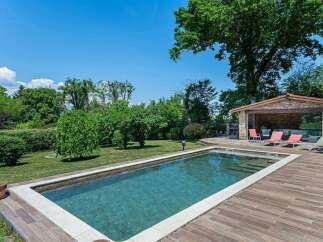 Luxury villa with private pool and outdoor entertainment area.