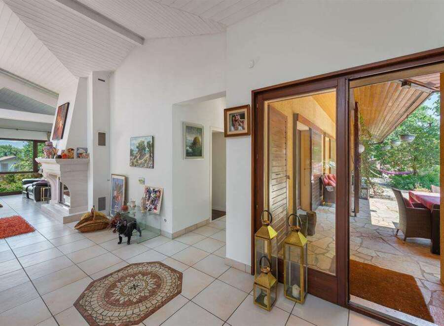 This stunning property boasts a spacious open-plan living area with high ceilings and large windows offering abundant natural light.