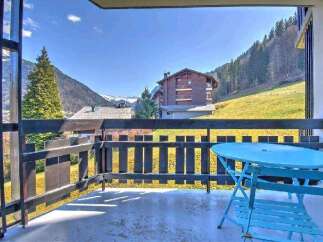 Enjoy breathtaking mountain views from your private balcony, complete with a charming bistro set for relaxing al fresco dining.