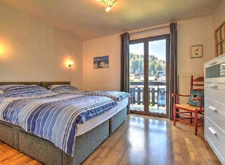 This charming bedroom boasts a comfortable double bed with crisp linens, perfect for a relaxing stay.