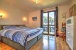 This charming bedroom boasts a comfortable double bed with crisp linens, perfect for a relaxing stay.