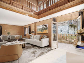 This stunning chalet boasts a spacious open-plan living area with high ceilings and large windows offering abundant natural light.