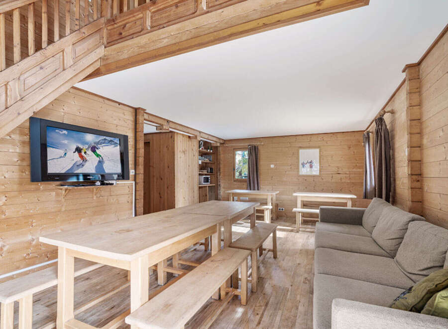 Cozy chalet with a large communal dining table perfect for family gatherings.