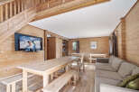 Cozy chalet with a large communal dining table perfect for family gatherings.