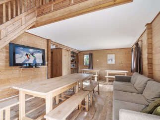 Cozy chalet with a large communal dining table perfect for family gatherings.