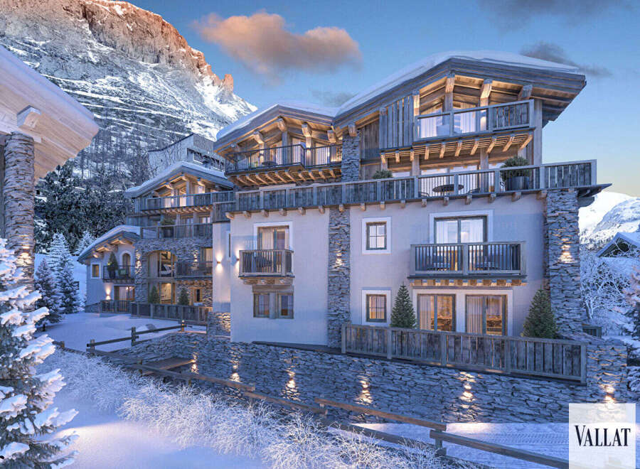Experience luxury mountain living in this stunning alpine residence, featuring exquisite stone and wood architecture.