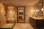 Step into luxury with this stunning bathroom featuring a spacious walk-in shower with a marble-like finish.