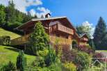 Nestled in a picturesque mountain setting, this charming chalet boasts stunning views and a tranquil atmosphere.