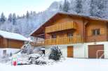 This stunning chalet boasts a prime location in a snow-covered mountain setting, offering breathtaking views.