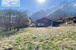 Discover a charming property nestled in a picturesque mountain setting.
