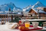 Enjoy a delightful breakfast on your balcony overlooking breathtaking snow-capped mountains.