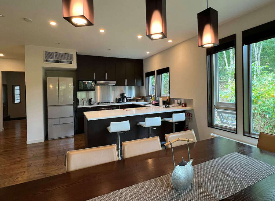 This stunning property boasts an open-concept kitchen and dining area, perfect for entertaining.