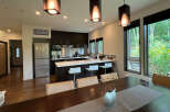 This stunning property boasts an open-concept kitchen and dining area, perfect for entertaining.