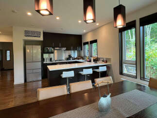 This stunning property boasts an open-concept kitchen and dining area, perfect for entertaining.