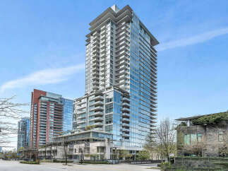 This stunning high-rise building boasts modern architecture with floor-to-ceiling windows offering breathtaking views.