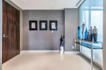 This stunning condo boasts a spacious entryway with sleek, modern design.