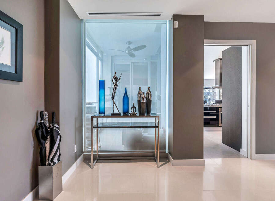This stunning condo boasts a spacious entryway with sleek, modern design elements.