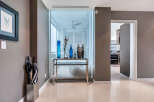This stunning condo boasts a spacious entryway with sleek, modern design elements.