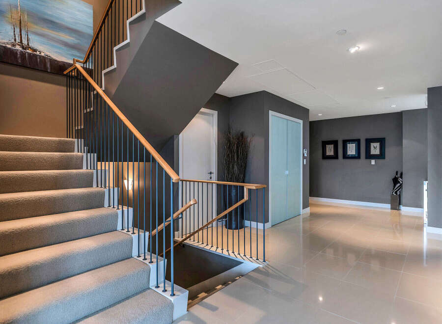 This stunning property boasts a modern, open-concept design with sleek lines and high-end finishes.