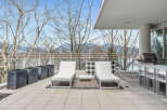This luxurious condo boasts a spacious balcony with stunning mountain views, perfect for outdoor entertaining.