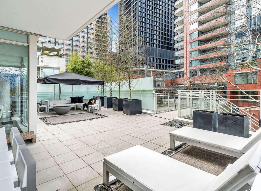 This luxurious condo boasts a spacious private patio, perfect for outdoor entertaining.