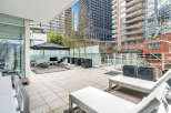 This luxurious condo boasts a spacious private patio, perfect for outdoor entertaining.