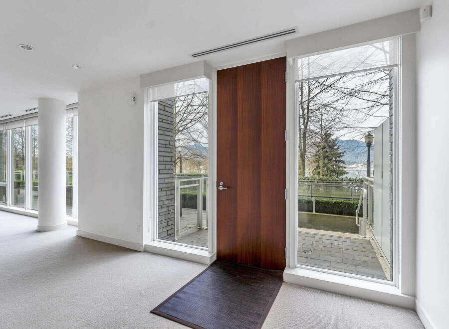 This stunning property boasts floor-to-ceiling windows offering breathtaking views, creating a bright and airy atmosphere.