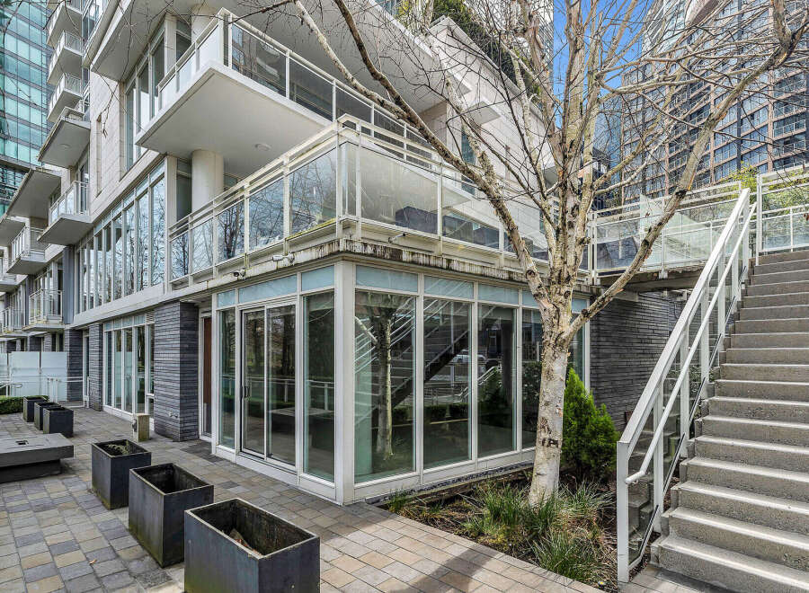 This stunning property boasts a private patio perfect for outdoor relaxation, complemented by modern architectural design and large windows offering ample natural light.
