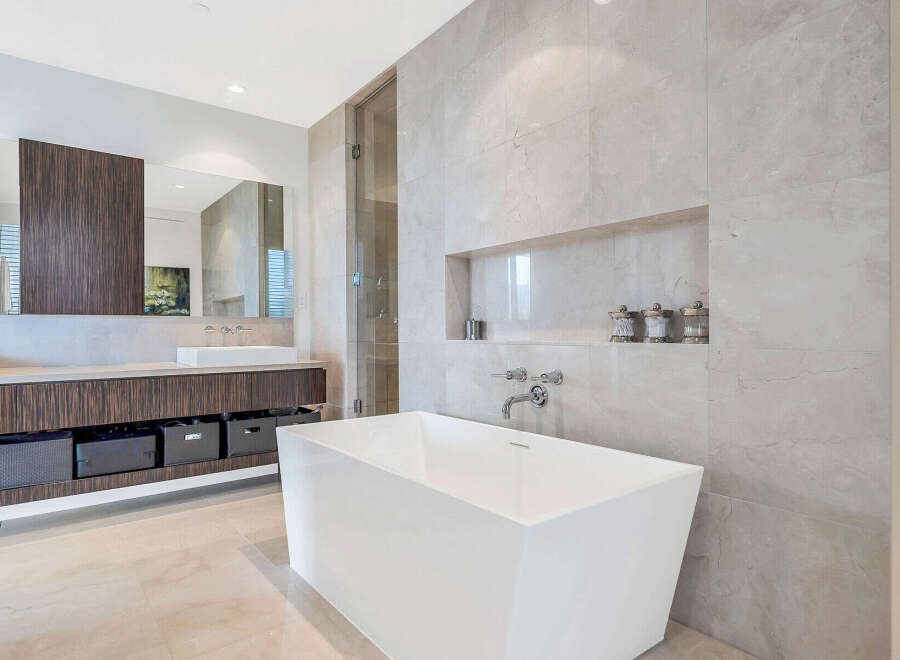 This luxurious bathroom boasts a freestanding soaking tub, perfect for relaxation.