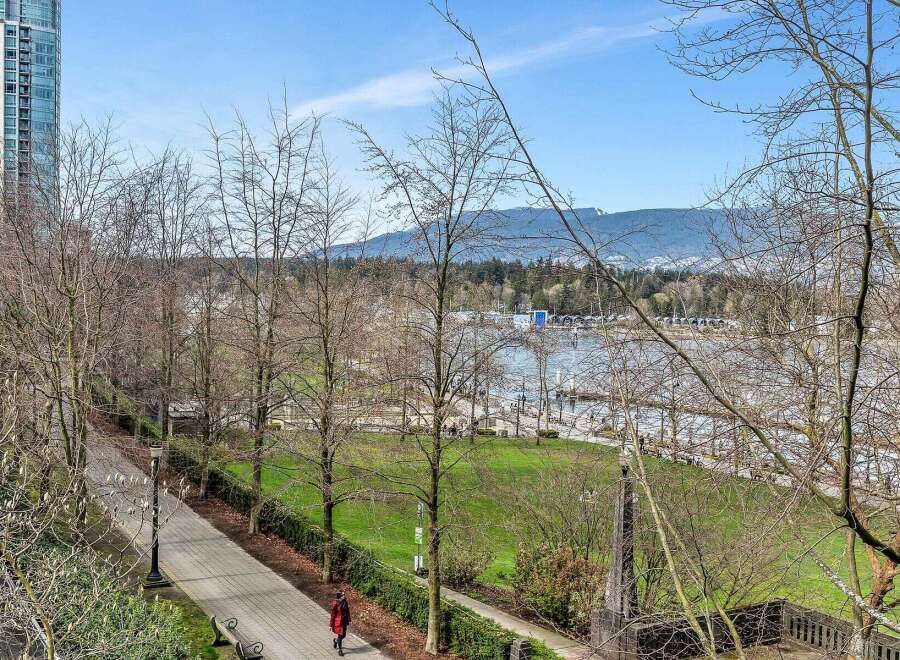 This stunning property boasts breathtaking views of the waterfront and mountains, offering a serene and picturesque setting.