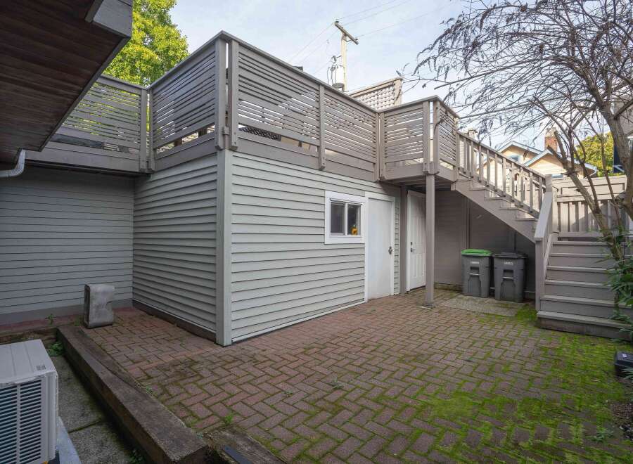 This charming property boasts a spacious backyard patio perfect for outdoor entertaining, complete with a convenient storage shed.