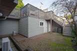 This charming property boasts a spacious backyard patio perfect for outdoor entertaining, complete with a convenient storage shed.